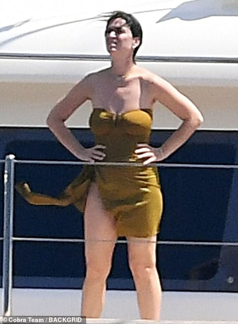 Katy Perry stuns in olive green swimsuit as she and shirtless fiancé