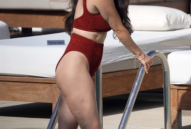 Casey Batchelor Shows Off Her Incredible Figure In A Brown Bikini In