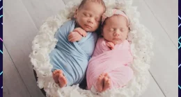 Two babies nestled together in a basket demonstrating Twins Birth