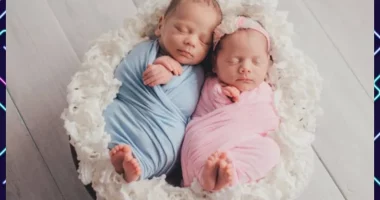 Two babies nestled together in a basket demonstrating Twins Birth