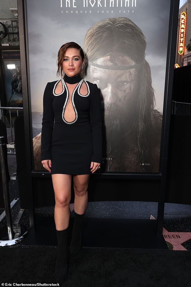 Florence Pugh looks edgy in a plunging cut-out mini dress at The