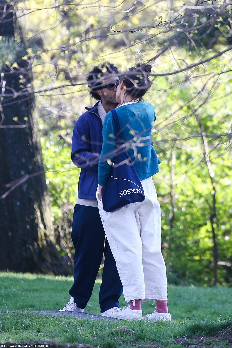 Katie Holmes shares a kiss with her boyfriend Bobby Wooten III as she