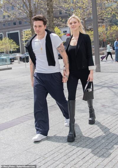 Brooklyn Beckham holds hands with glamorous new wife Nicola Peltz as