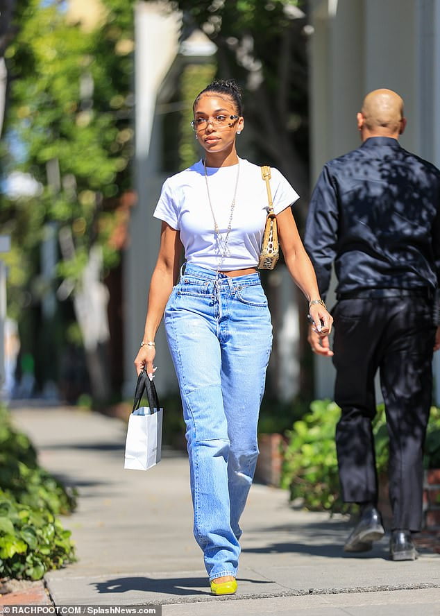 Lori Harvey Shows A Hint Of Her Toned Midriff In A White Crop Top And