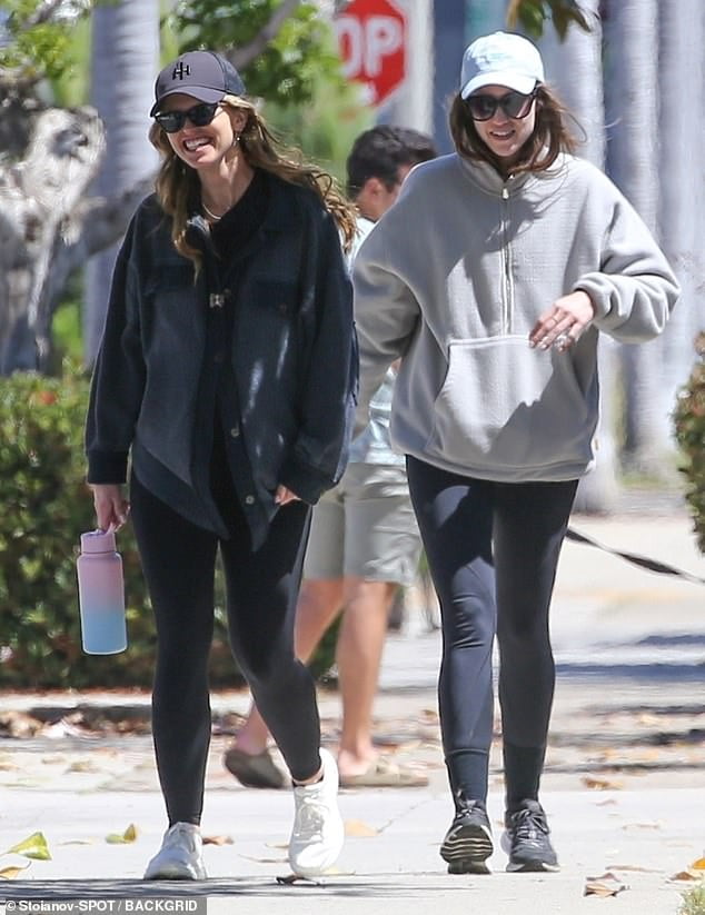 Pregnant Katherine Schwarzenegger shares a laugh with sister Christina