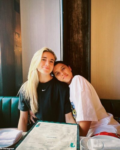 Soccer stars Samantha Kerr and Kristie Mewis pack on the PDA as they