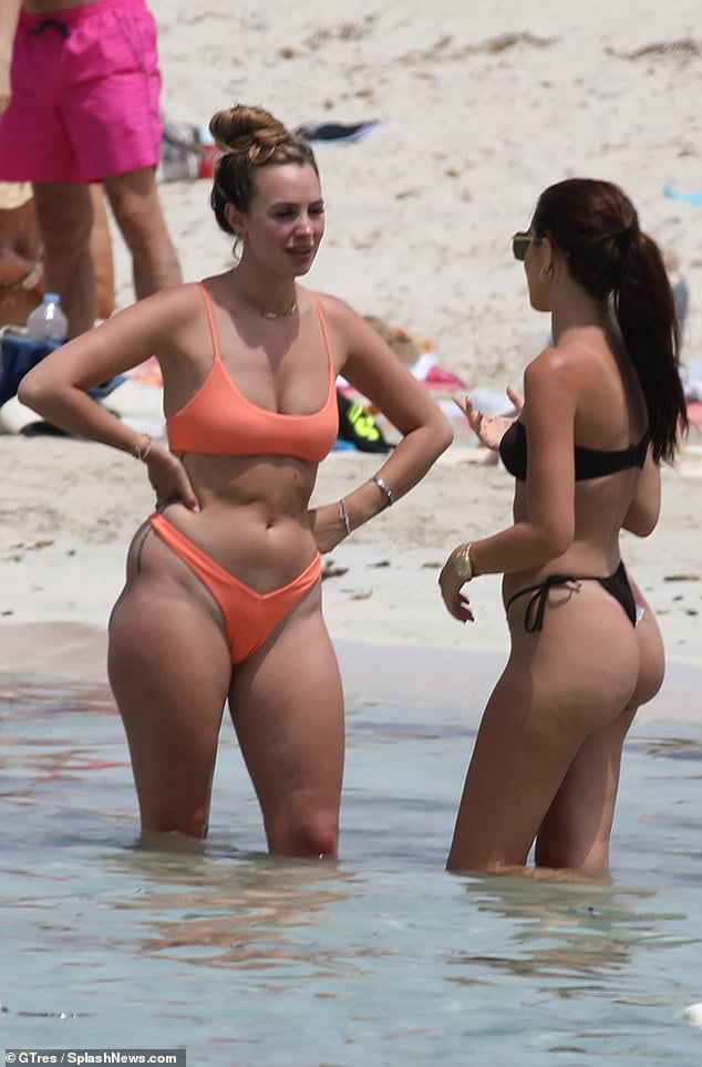 Amber Dowding dons an orange bikini while on holiday in Spain showing