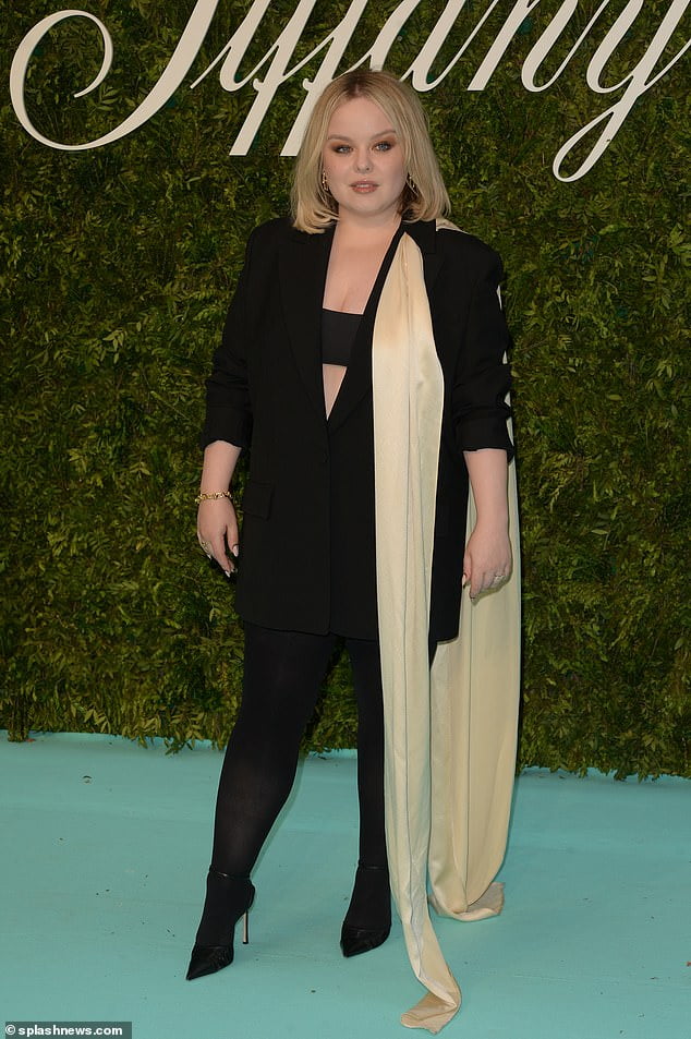 Nicola Coughlan catches the eye in a plunging black blazer dress with a