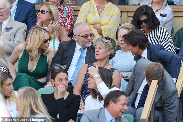 Jodie Comer puts on a busty display as she mingles with Tom Cruise in