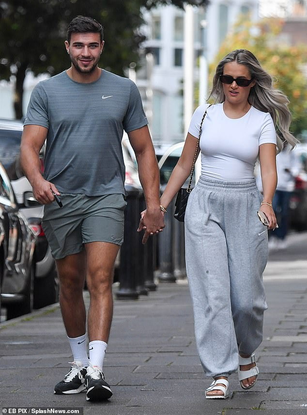 Molly-Mae Hague puts on a loved-up display with Tommy Fury as they walk ...