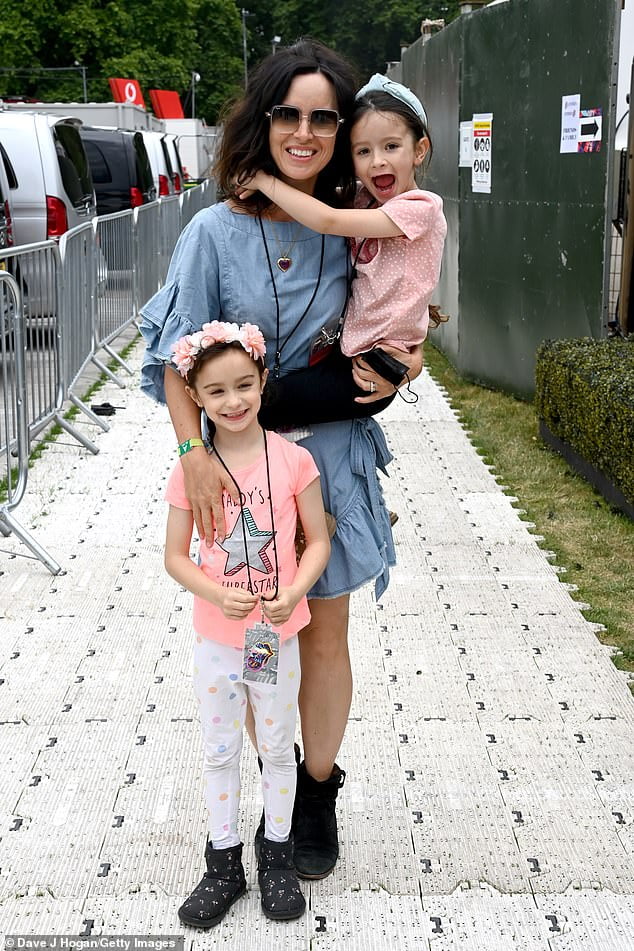 Sally Wood poses for adorable snap with her twin daughters at American Express present BST