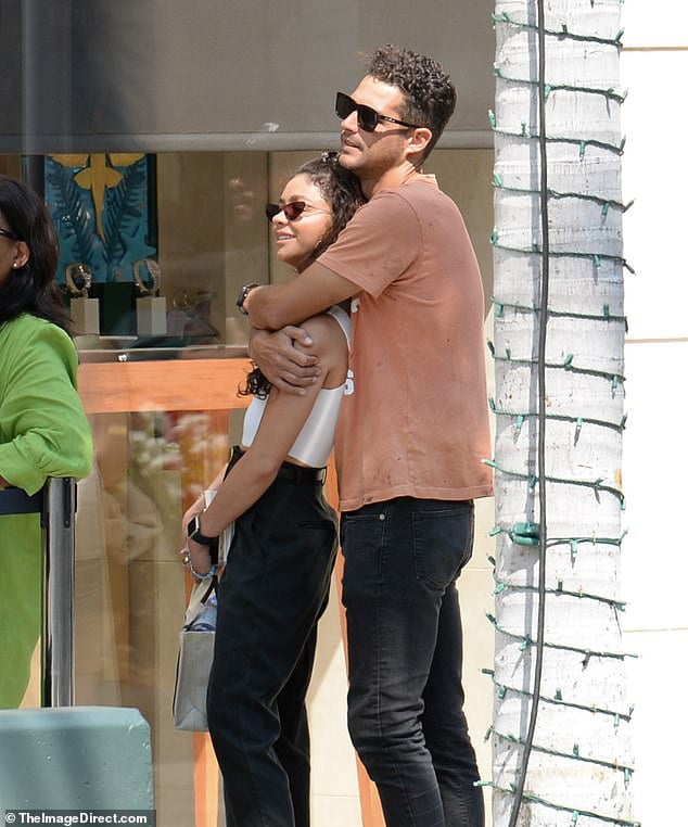 Sarah Hyland is embraced by fiance Wells Adams as they go jewelry ...