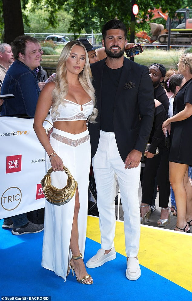 Towies Amber Turner Parades Her Washboard Abs As She And Dan Edgar Attend The 2022 Tric Awards