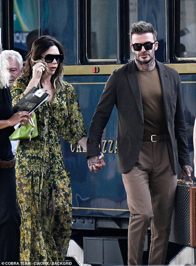 Victoria Beckham puts on a loved-up display with her husband David as ...