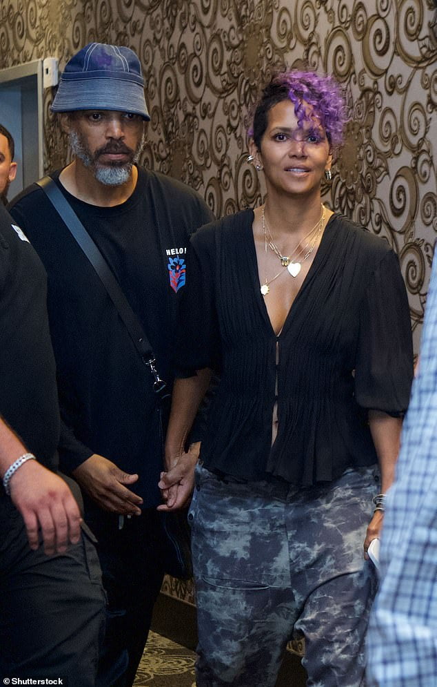 Halle Berry debuts striking purple curls as she cosies up to her ...