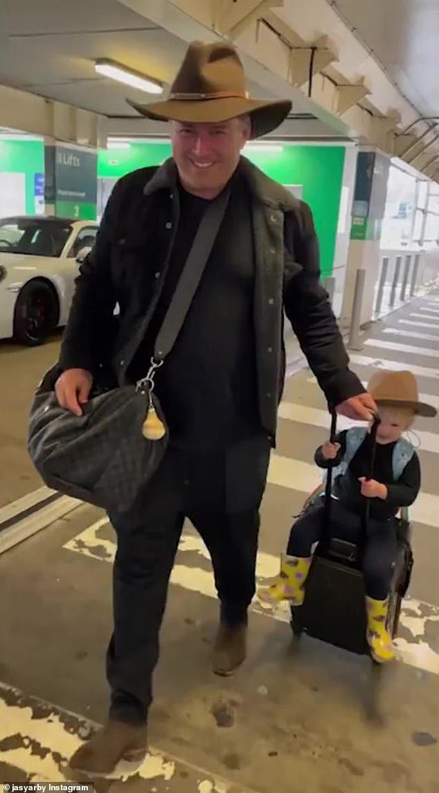 Karl Stefanovic's adorable daughter Harper rides along on his luggage ...