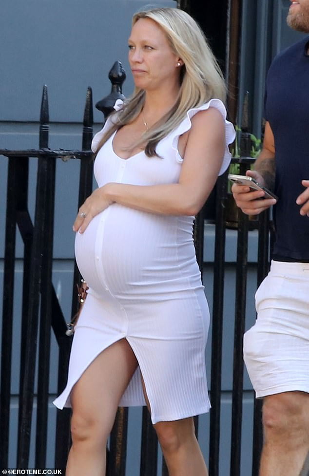 Pregnant Chloe Madeley shows off her baby bump in a tight white dress