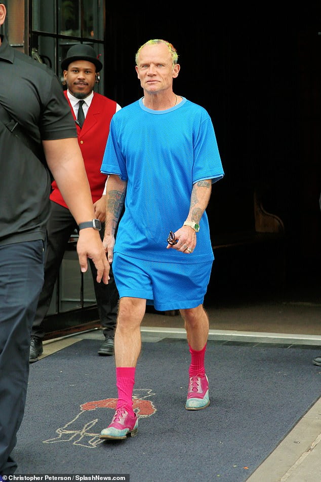 Red Hot Chili Peppers star Flea shows off colorful 'do and outfit