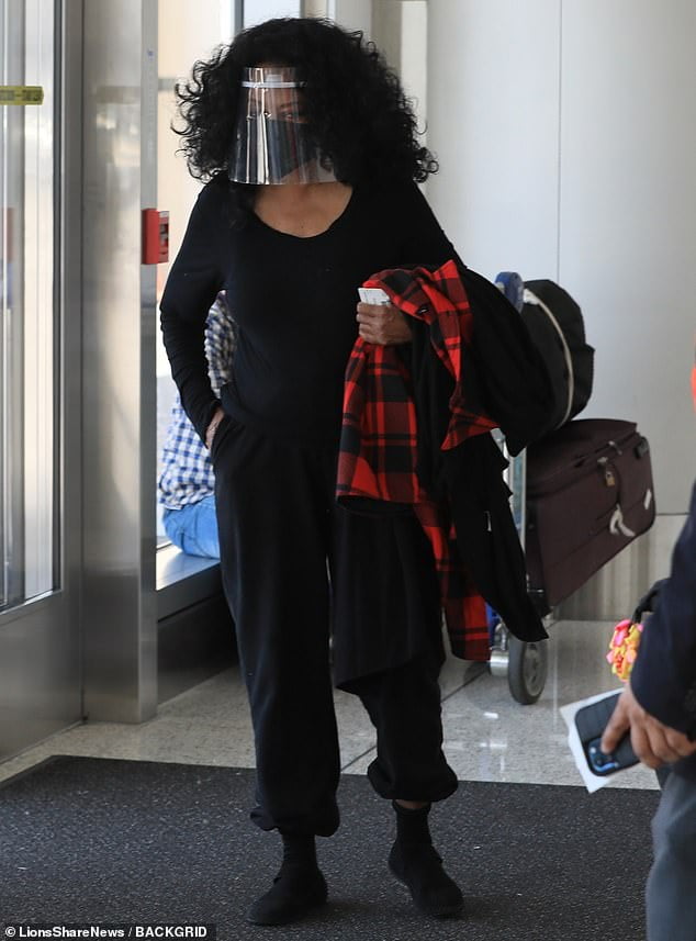Diana Ross wears two protective masks as she leaves LAX Airport… after