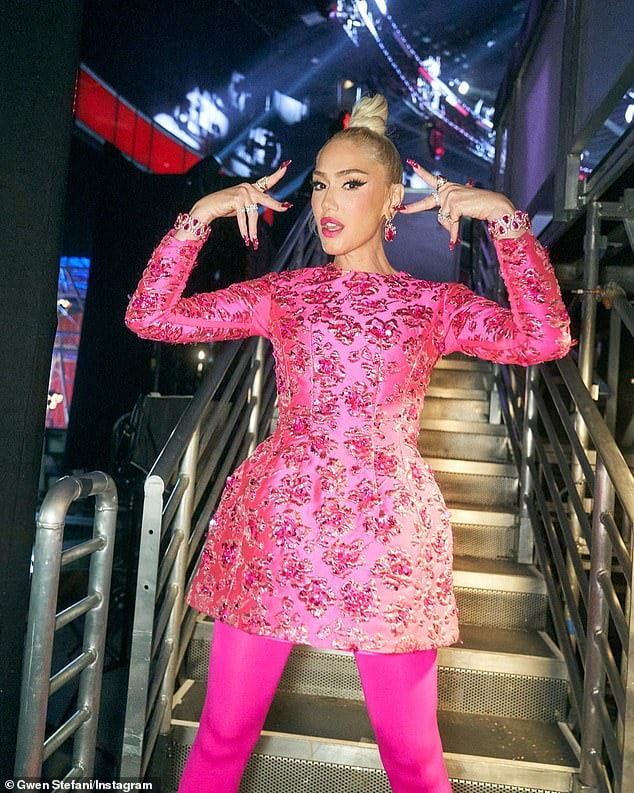 Gwen Stefani cuts a fashionable figure in pink dress and tights in ...