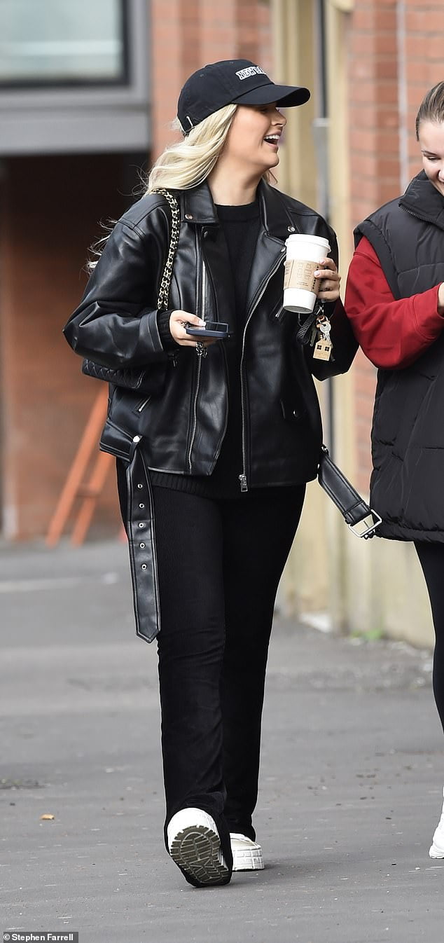 Molly-Mae Hague dons an oversized leather jacket as she has a giggle
