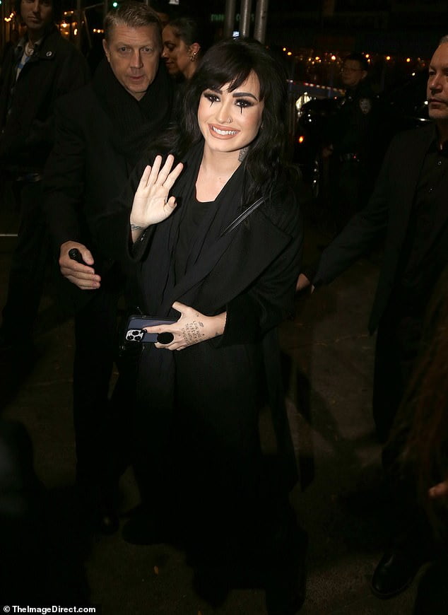 Demi Lovato goes goth with tear drop eyeliner and an edgy nose ring at