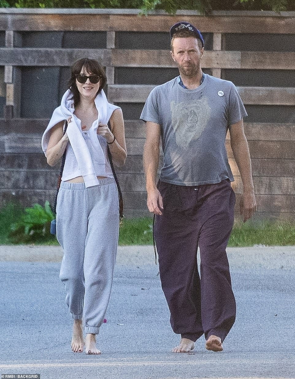 PICTURE EXCLUSIVE: Dakota Johnson wraps her arms around boyfriend Chris