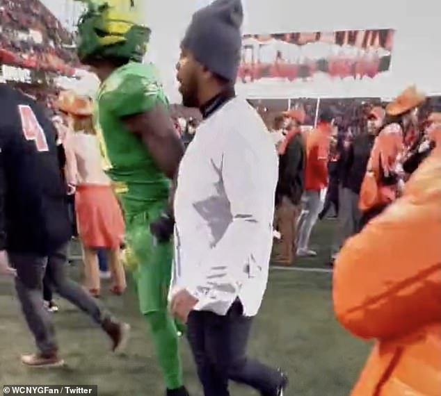 University of Oregon football player punches State fan from behind