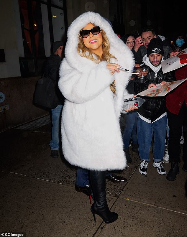 Mariah Carey bundles up in huge coat and leather boots while heading to ...