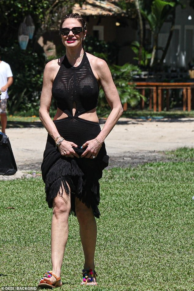 Mick Jagger's ex Luciana Gimenez shows off her figure in a black mesh cutout dress Sound