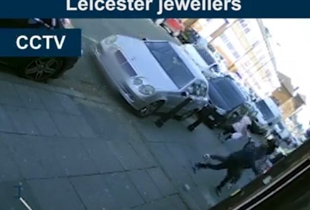 Moment Armed Robbers Smash Into Jewellers Using A Pick Axe And Hammer And Swipe £40000 Of Goods 