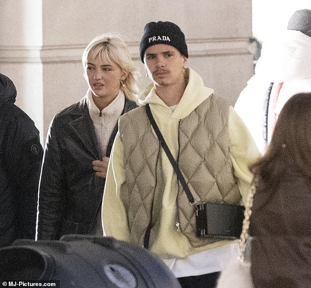 Romeo Beckham and Mia Regan looked loved-up on cosy shopping trip