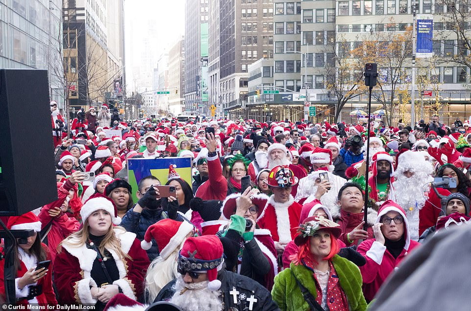 Thousands of St Nick fans flock to NYC for SantaCon as NYPD braces