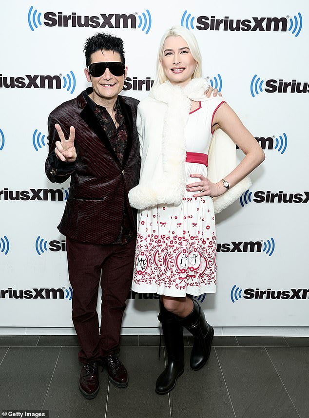 Corey Feldman rocks a smoking jacket with wife Courtney Anne Mitchell on a visit to SiriusXM