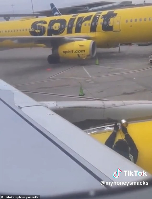 Spirit Airlines Passenger Films An Employee Putting Tape On The Plane Before Takeoff Sound